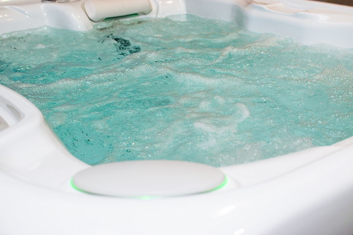 Modern bubbling jacuzzi in a spa or in a luxury hotel, apartment.